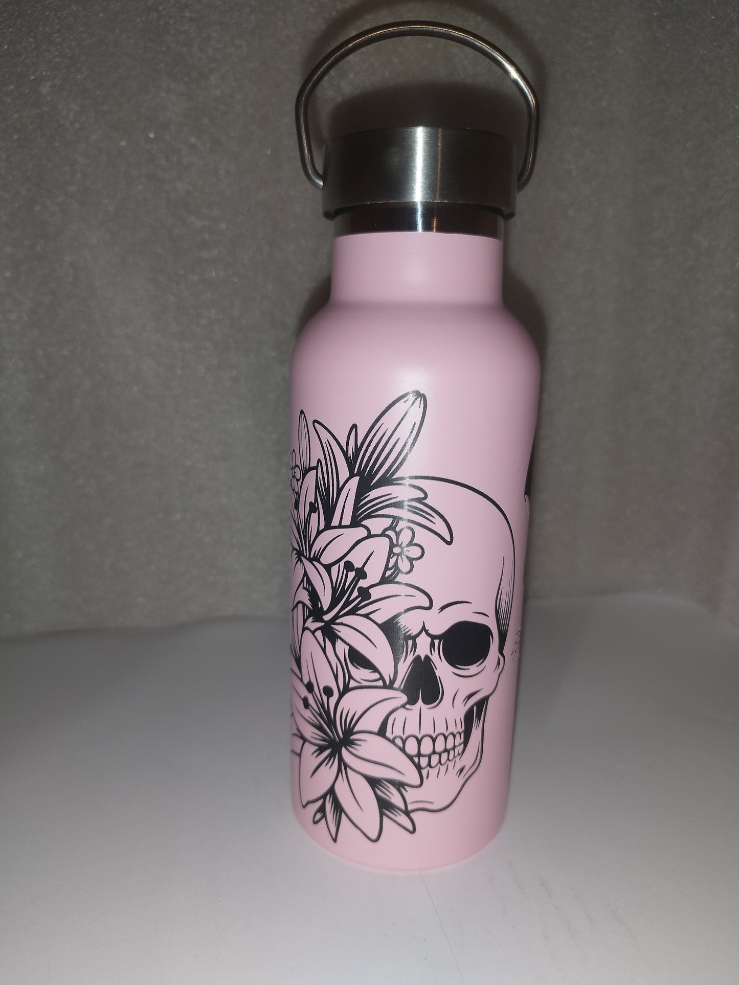 Pink skull engraved bottle
