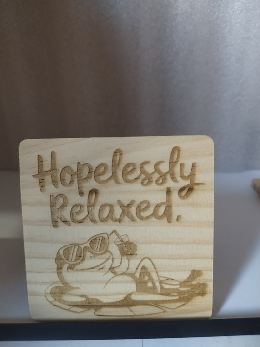 Hopelessly relaxed engraved wood coaster