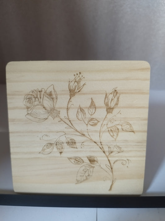 Budding rose engraved wood coaster