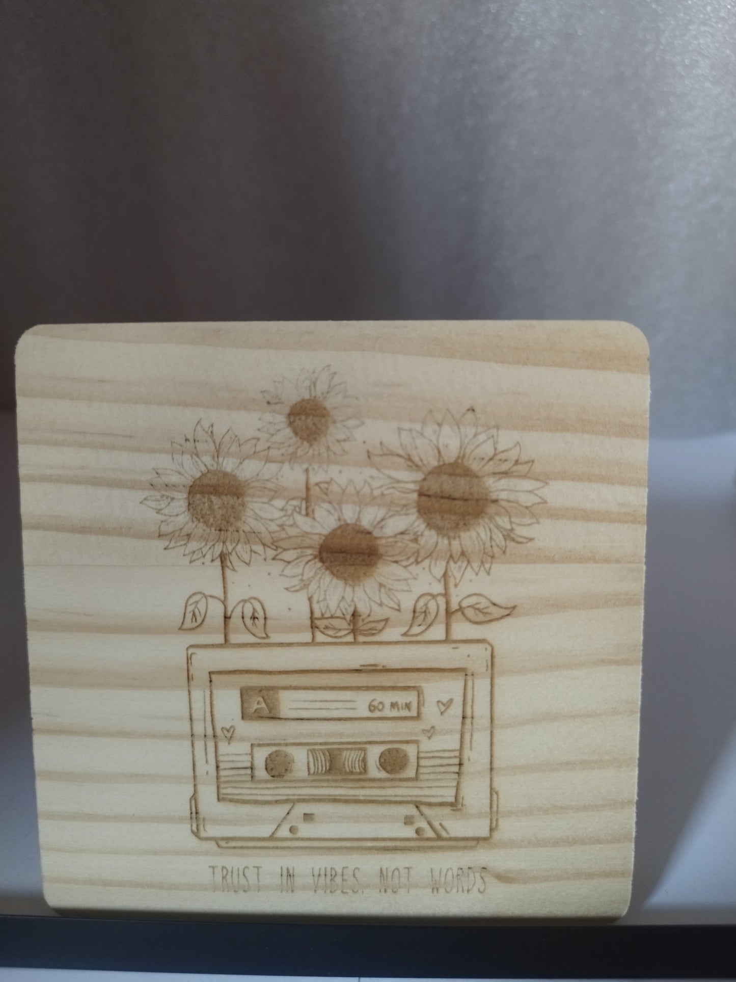 Tape engraved wood coaster